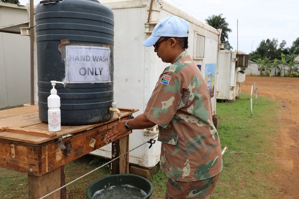 MONUSCO Force Intervention Brigade troop washing hands in Beni, North Kivu, DRC. Photo by MONUSCO Photos.