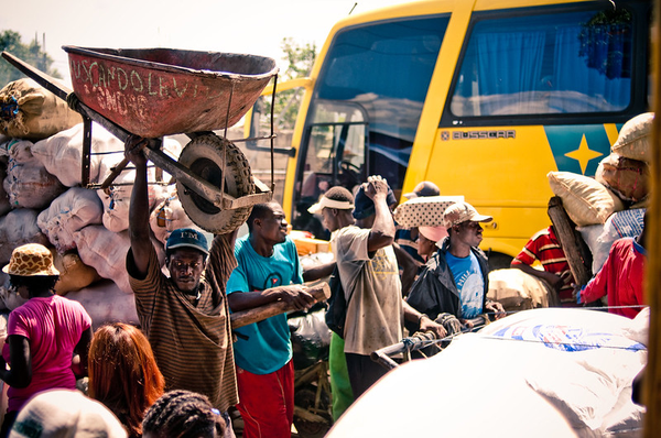 People moving goods into Haiti at the border of Dominican Republic