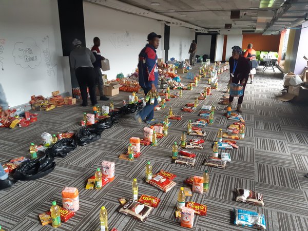 Volunteers in Philippi, Cape Town packing COVID food parcels_Photo_Discott_CCBYSA.jpg