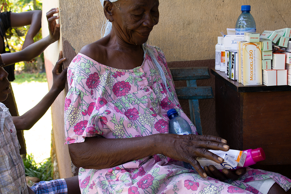 Woman receiving medication in rural Haiti.png